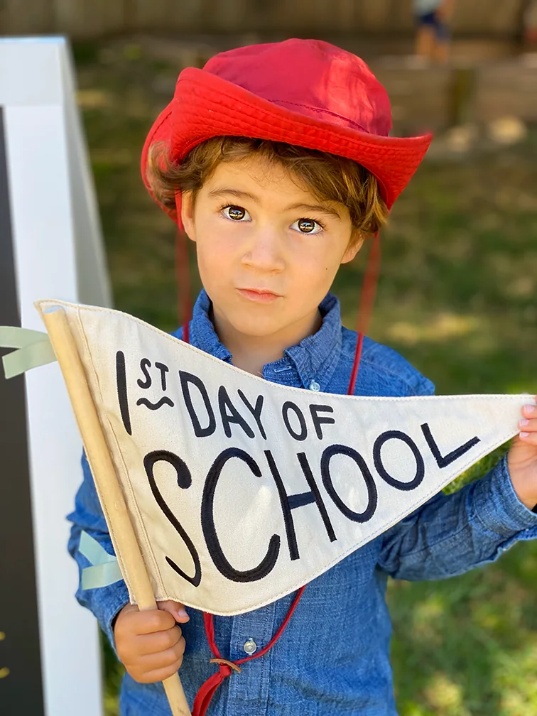 Young child celebrating the first day of school
